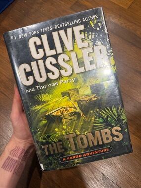 Clive Cussler "The Tombs" Hardcover Book - Green/Gold Cover